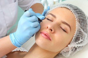 preparation-of-the-patients-face-to-a-cosmetic-procedure-picture-id509294104